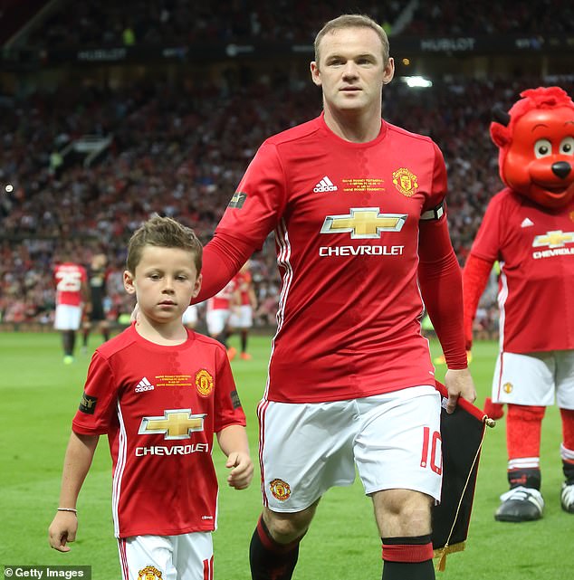 Kai pictured with Wayne Rooney at the latter's Testimonial match at Old Trafford in 2016