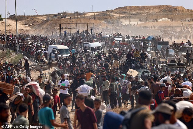 Pictured: Displaced Palestinians gather to receive aid run by the US and Israeli-backed Gaza Humanitarian Foundation (GHF) on August 4