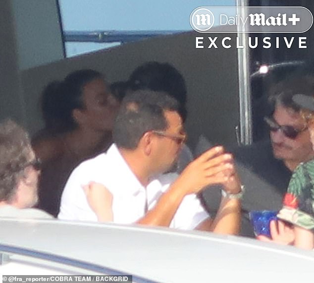 It wasn't only their toned physiques turning heads - the couple's steamy PDA had onlookers swooning