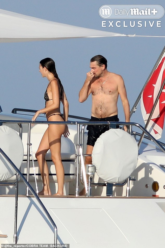 The Titanic star appeared smitten, gazing at his girlfriend as she soaked up the rays