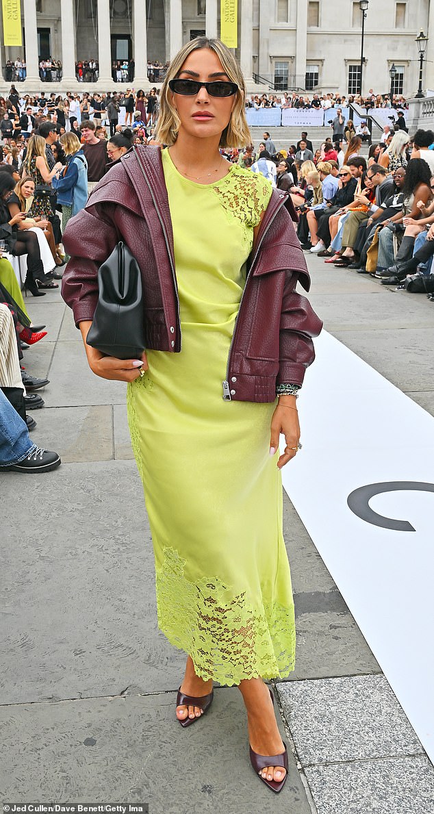 She paired her bright garment with a maroon leather jacket, a pair of open-toe heels and slipped a black cutch under her arm