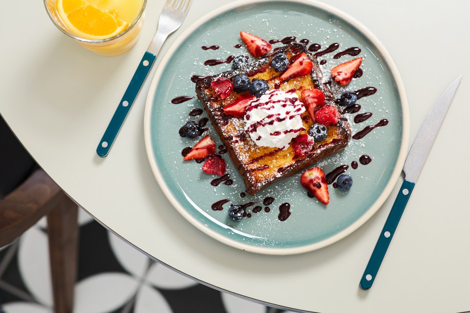French toast with berries and whipped cream.