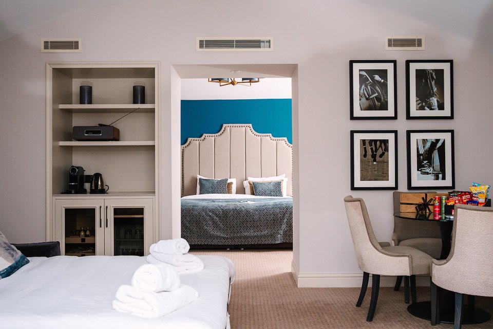 Royal Berkshire Hotel suite with bedroom and sitting area.