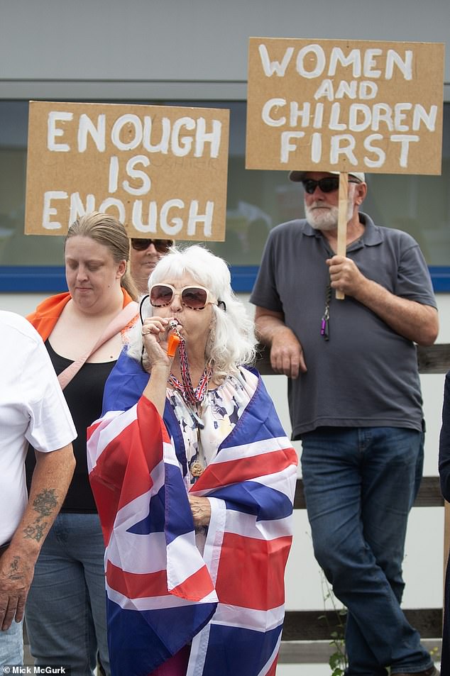 Protestors in Falkirk on Saturday held banners reading: 'Enough is enough' as well as: 'Women and children first'