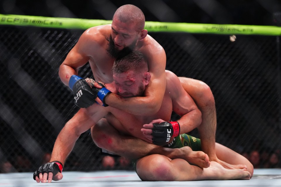 CHICAGO, ILLINOIS - AUGUST 16: Khamzat Chimaev of Russia controls Dricus Du Plessis of South Africa on the mat in the UFC middleweight championship fight during the UFC 319 event at the United Center on August 16, 2025 in Chicago, Illinois. (Photo by Cooper Neill/Zuffa LLC)