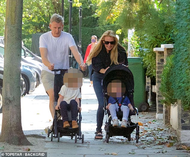 The former couple have two sons together. The family pictured in London, where they relocated after previously living in Los Angeles