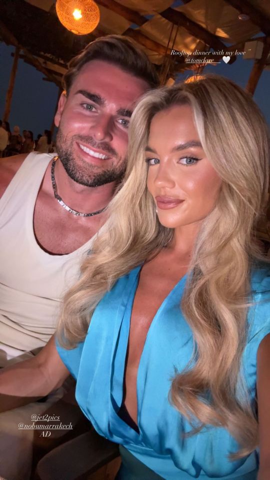 Photo of Tom Clare and Molly Smith at a rooftop dinner in Marrakech.