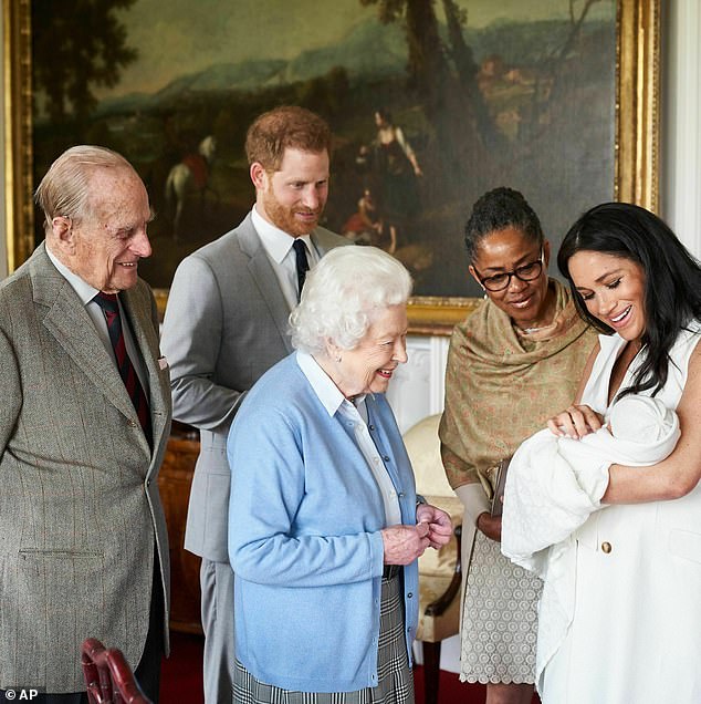 'The inconsistencies of Meghan's excuses not only irritated Charles but also the Queen.' Pictured: Prince Philip, Harry, the Queen and Doria meet baby Archie in May 2019 at Windsor Castle