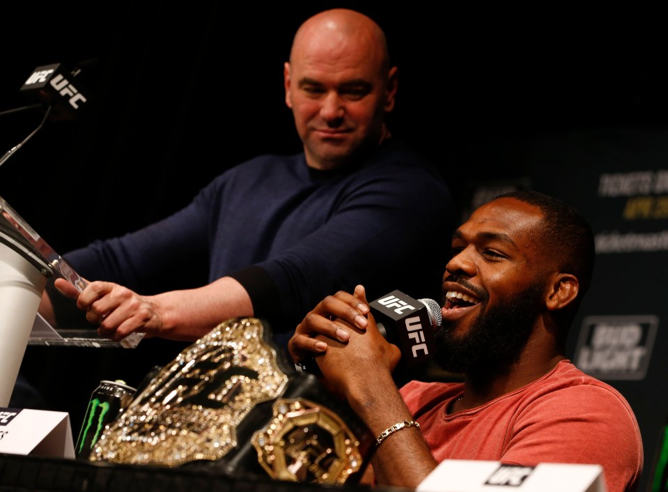 a man holding a microphone that says ufc on it