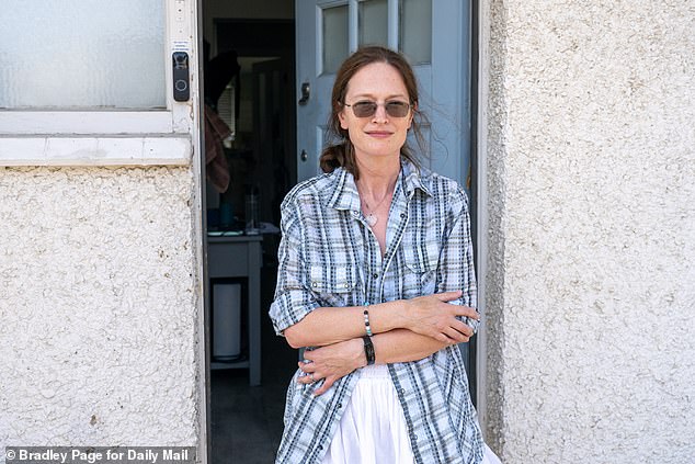 Claire Lewis, (pictured) who has lived across the street with her family for fourteen years said she's become accustomed to the decayed home