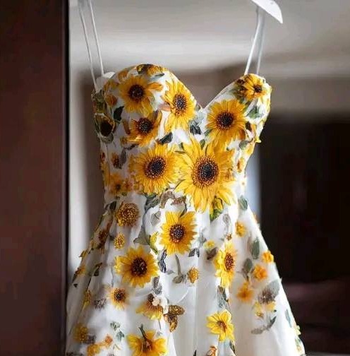 Collage of a white dress adorned with sunflowers.