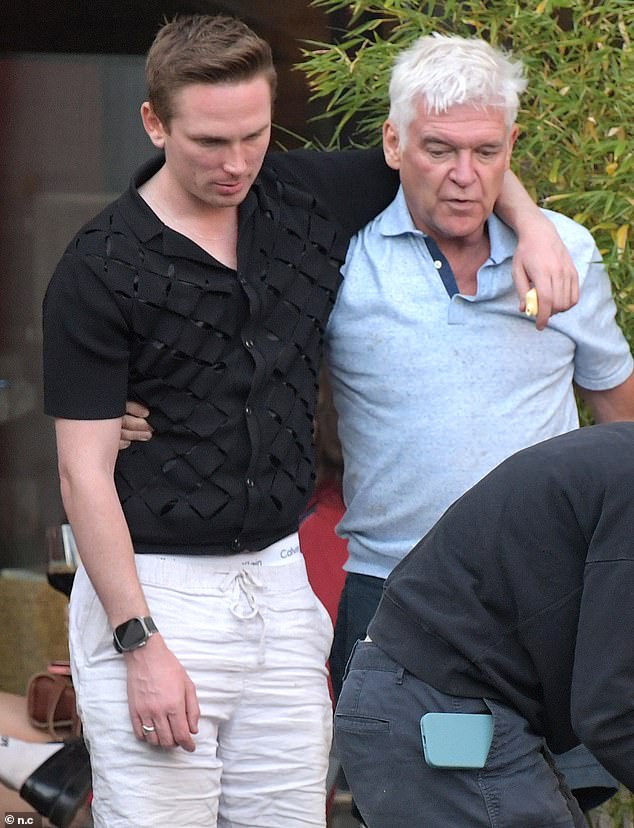 Joshua has been revealed as one of two men helping the fallen star get his life back on track