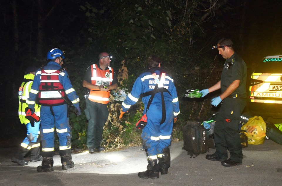 Emergency services personnel at a nighttime incident.