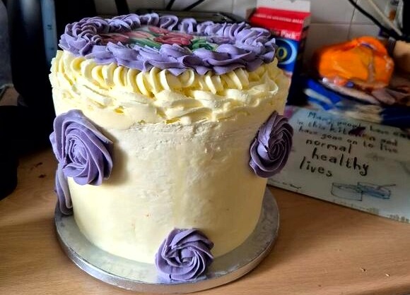 A photo of a birthday cake that is much larger than expected.