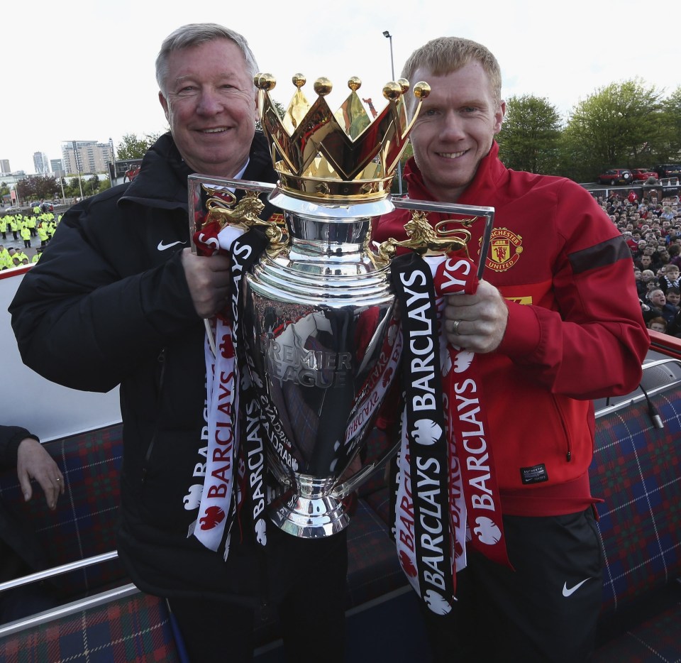 Sir Alex Ferguson and Paul Scholes with the Premier League trophy.