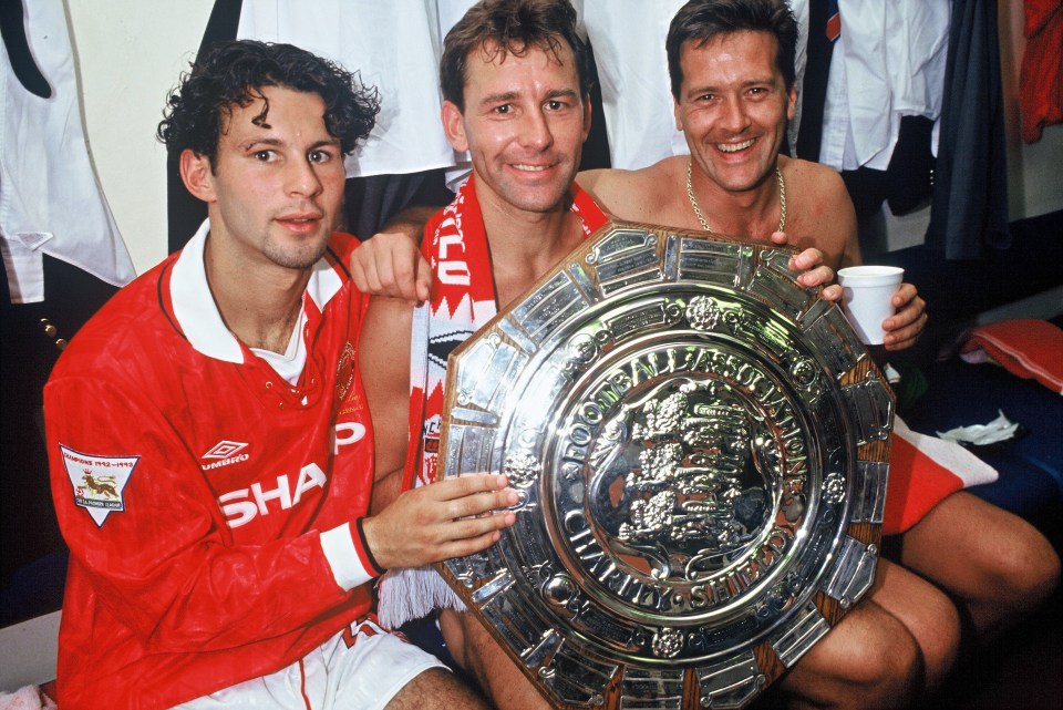 Ryan Giggs, Bryan Robson, and Les Sealey with the Charity Shield trophy.