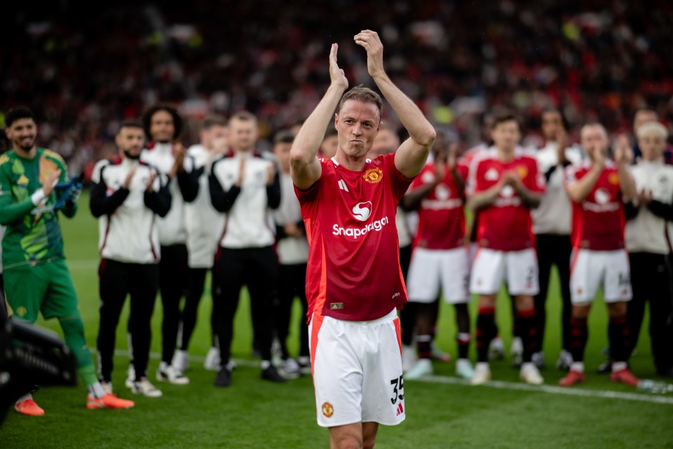 Jonny Evans of Manchester United applauding fans.