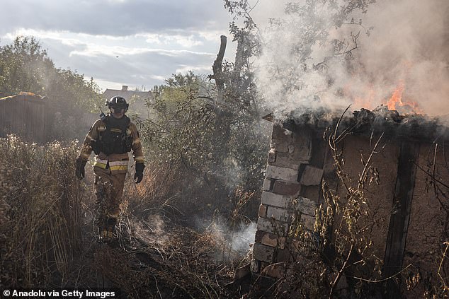 Ukrainian firefighters work to extinguish a blaze after a Russian shelling hit a house, when a Russian FPV drone attack damaged their fire truck during the operation, in Kostiantynivka, Ukraine, on August 16, 2025