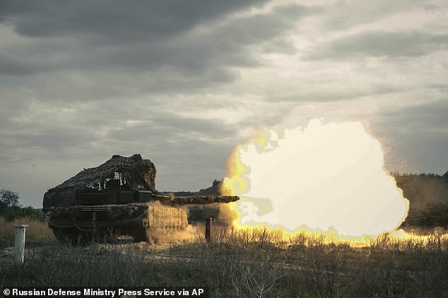 A Russian tank fires during a practice session at an undisclosed location in Ukraine on Friday