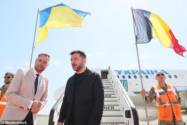 Belgian Foreign Minister Maxime Prevot welcomes Ukraine's President Volodymyr Zelensky to Melsbroek Air Base near Brussels today ahead of a meeting with European leaders