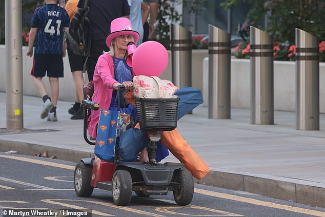 The Britannia International Hotel in London is being used to accommodate hundreds of asylum seekers. Pictured: A 'Pink Lady protester
