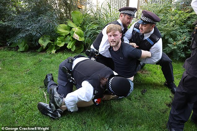 Several men were seen being detained by police after a string of arrests were made in recent weeks