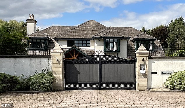 Pictured: A riverside mansion in an exclusive part of leafy Cheshire owned by conman Kapikanya between 2006 and 2007