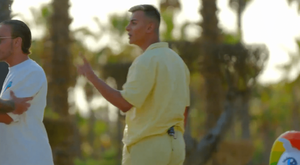 Screenshot of two men arguing outdoors.