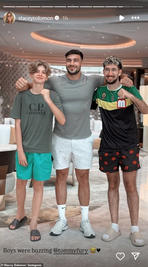 Stacey also uploaded a snap of her son Leighton, 12, posing with Tommy and a pal as she told how her boys were 'buzzing' to meet the boxer
