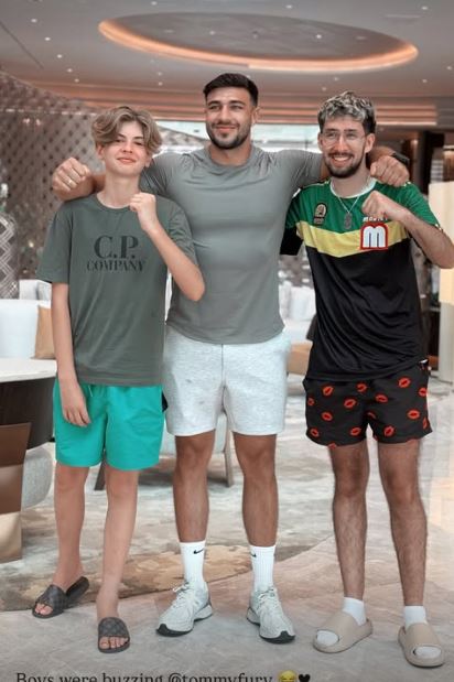 Three men posing for a photo.