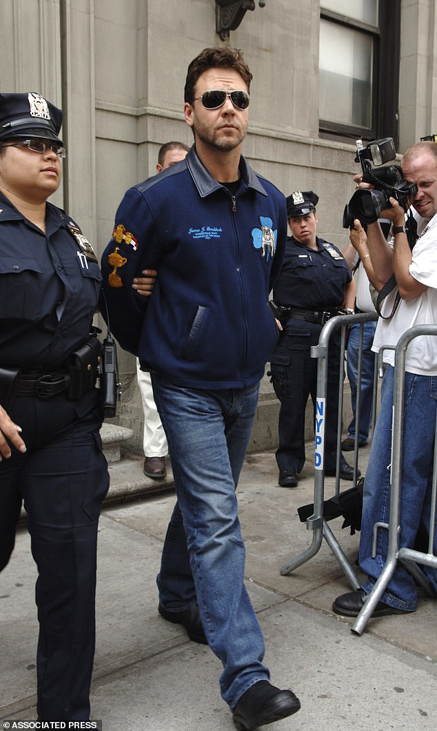 The New Zealand-born actor spent six hours in a New York jail after throwing a phone at a reception employee at the Mercer Hotel. He was famously led from the luxury hotel in handcuffs (pictured)