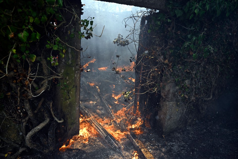 A house burning during a wildfire in Spain.