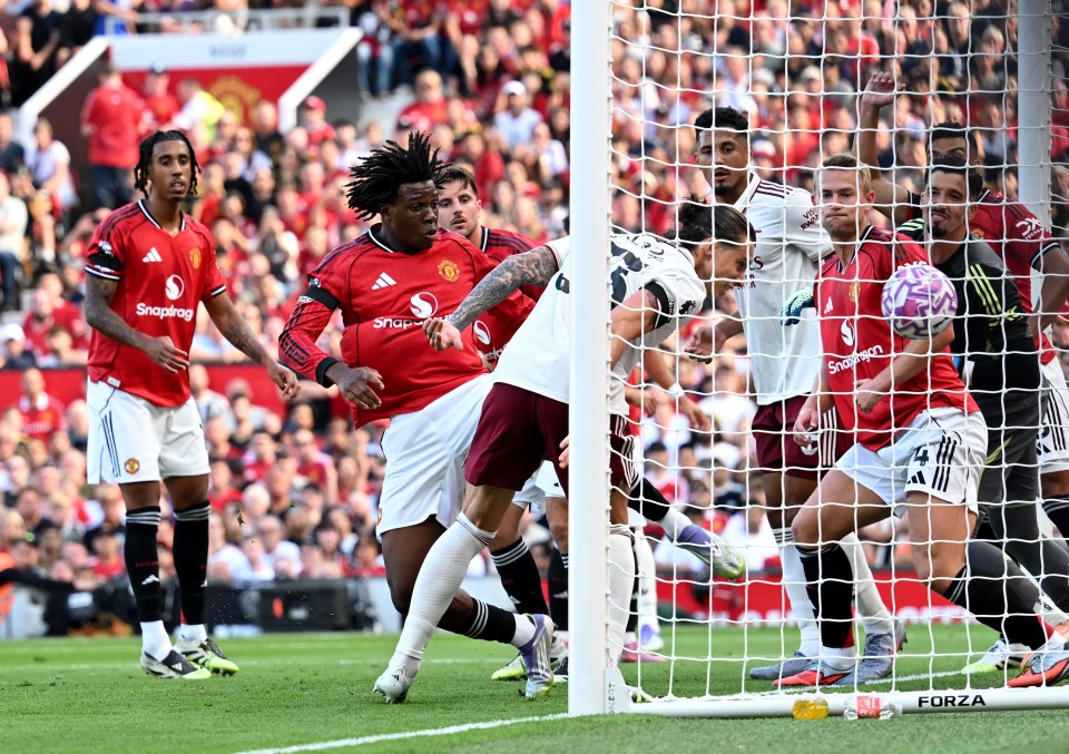 Riccardo Calafiori scoring a goal for Arsenal against Manchester United.