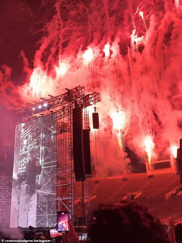 At the end of the show, the band closed with fireworks that Hudgens recorded to document the exciting moment as she danced among the crowd of concertgoers