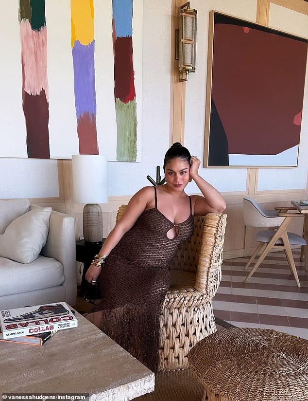 The star cradled her baby bump and grinned widely ahead of her due date