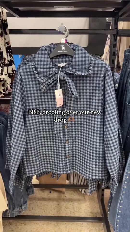 Blue and white gingham shirt on display at Sainsbury's.