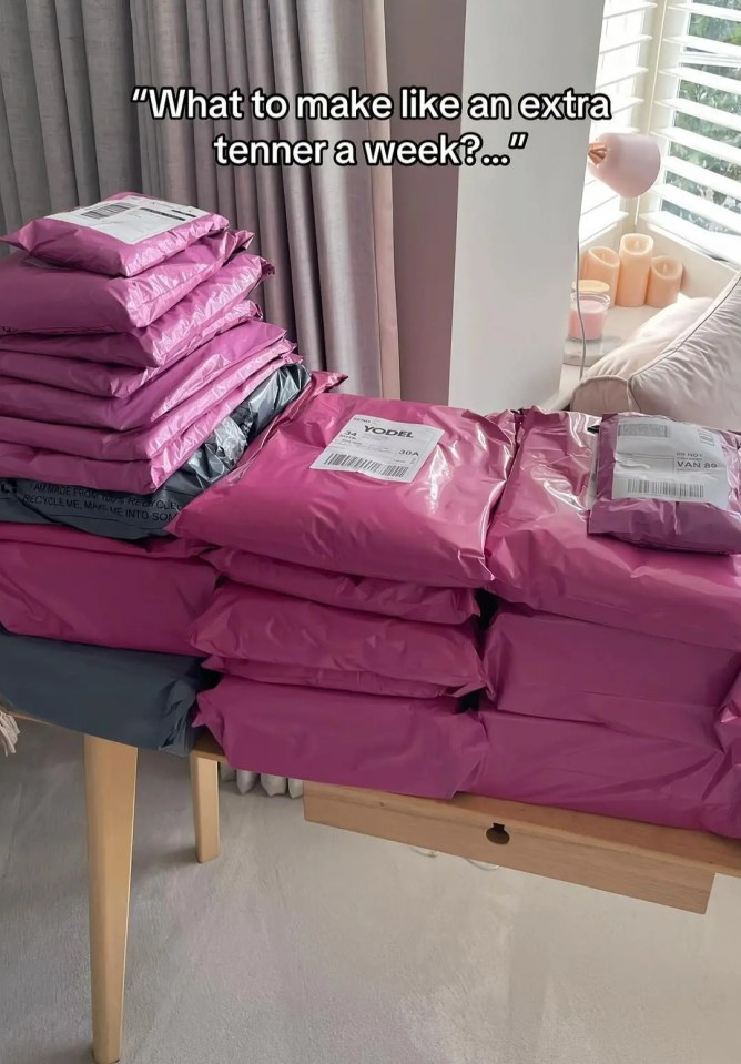 Stacks of pink shipping packages on a table.