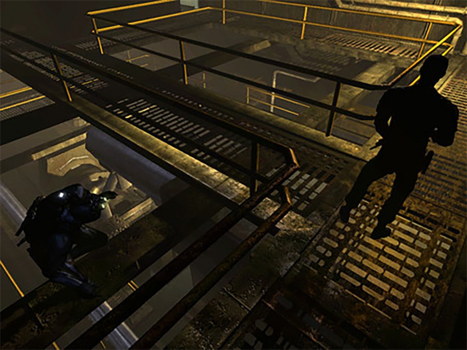 Two figures in dark clothing on an industrial catwalk.