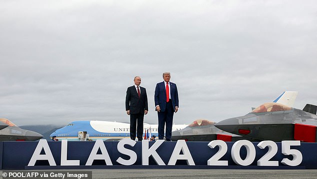 U.S. President Donald Trump and Russian President Vladimir Putin pose for photos during a U.S.-Russia summit on Ukraine at Joint Base Elmendorf-Richardson in Anchorage, Alaska