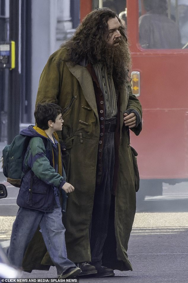 Hot Fuzz and Shaun of the Dead legend Nick, 53, donned long curly hair and a matching beard (pictured right)