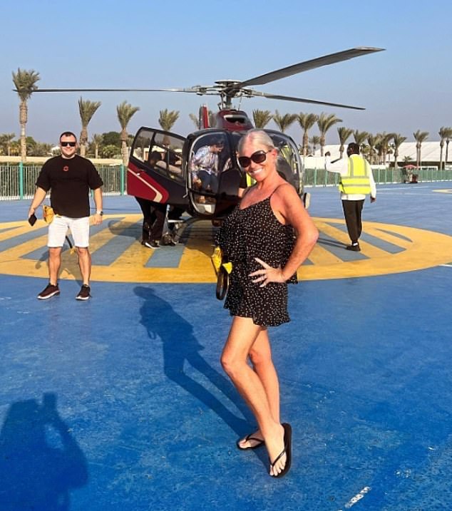 The influencer's mum Ms Sullivan, 59, (pictured) is seen catching helicopter rides, dining at five star restaurants and owning an array of designer handbags