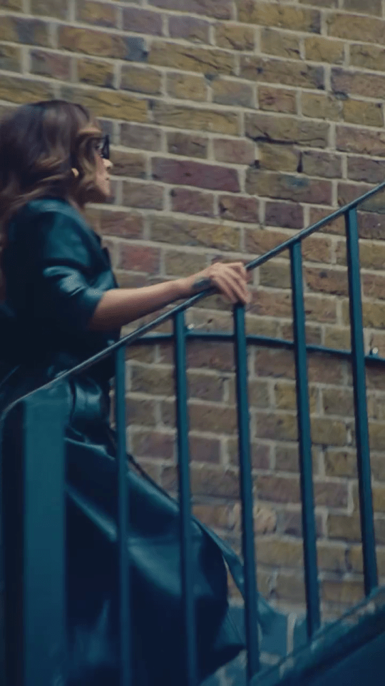 Cheryl climbing a brick staircase.