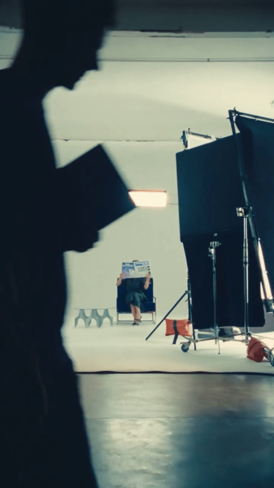 Behind-the-scenes photo of Cheryl Cole during a photoshoot.