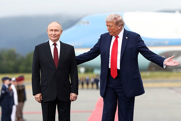 U.S. President Donald Trump stands with Russian President Vladimir Putin, as they meet to negotiate for an end to the war in Ukraine, at Joint Base Elmendorf-Richardson in Anchorage, Alaska, U.S., August 15, 2025. REUTERS/Kevin Lamarque