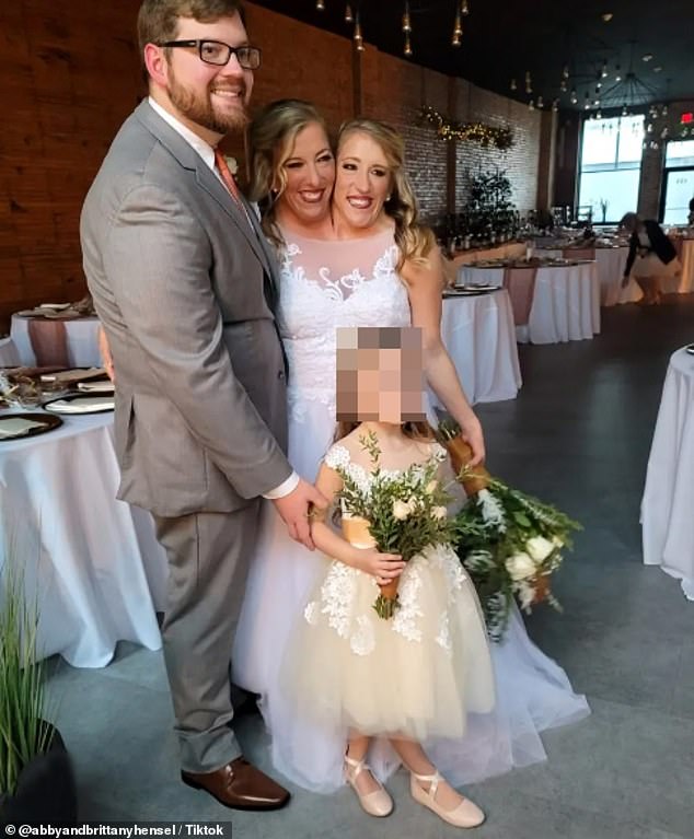 Abby and Brittany are pictured at Abby's wedding to U.S. Army veteran Joshua Bowling in 2021