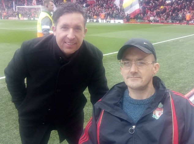 Mogan pictured with Liverpool legend Robbie Fowler. If found guilty of racism, the fan will be banned by Liverpool for life