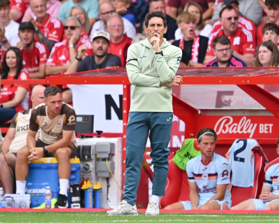 Brentford manager Keith Andrews on the sidelines of a football match.