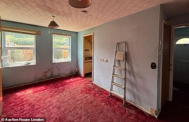 Upon entering the house, prospective buyers are greeted with a red carpet - but it is by no means glamorous