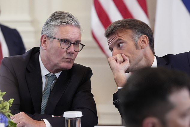 British Prime Minister Keir Starmer, left, and France's President Emmanuel Macron participate in a meeting with President Donald Trump and Ukrainian President Volodymyr Zelenskyy in the East Room of the White House, Monday, Aug. 18, 2025, in Washington. (AP Photo/Alex Brandon)