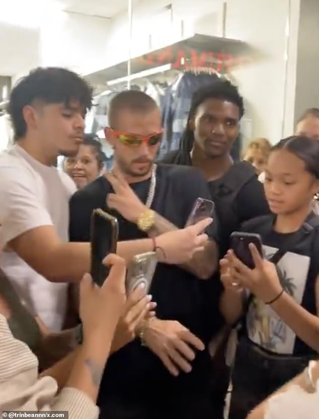 The impersonator was also seen posing with fans at the venue